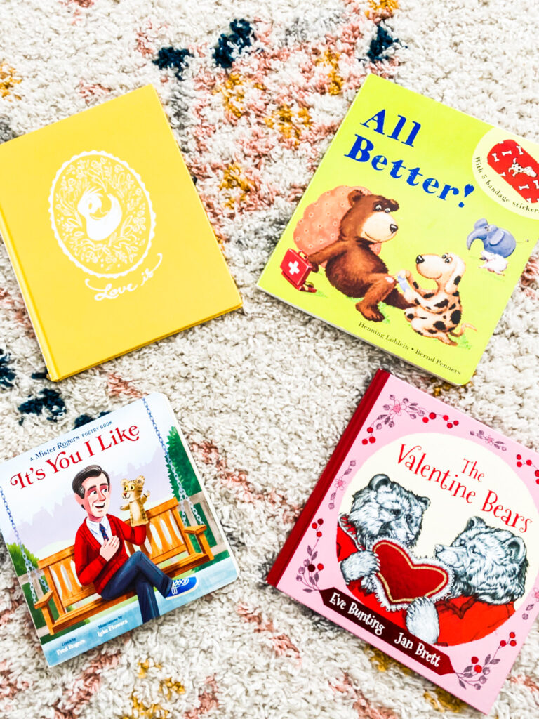 Variety of kids valentine's books on a pike and white rug